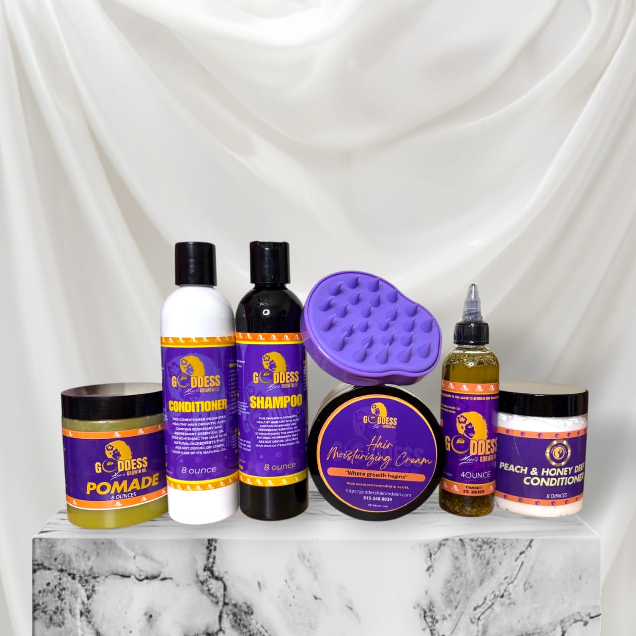 Hair Growth & Repair Kit featuring shampoo, conditioner, pomade, and moisturizing cream on a marble surface.